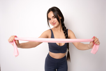 Healthy beautiful sportswoman wearing tracksuit looking camera isolated over white background