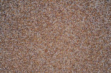 a brown and white background with small sand in the middle