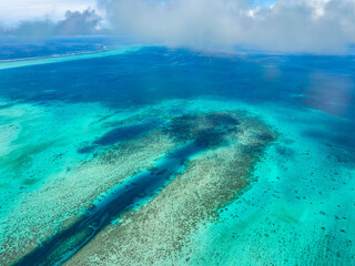 Aerial view of the beautiful ocean with bluish-turquoise waters