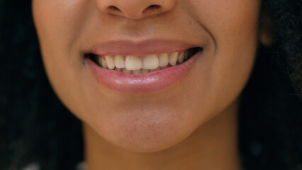 Close up happy African American woman beautiful lips mouth toothy dental smile female ethnicity...