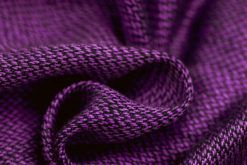 Close-up of purple fabric on blue background