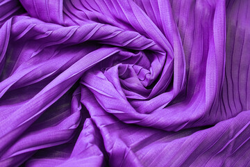 Purple fabric with oversized pleat design and high neckline