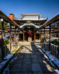 Naklejka premium Ancient snow covered Buddhist temple in Kyoto Japan.