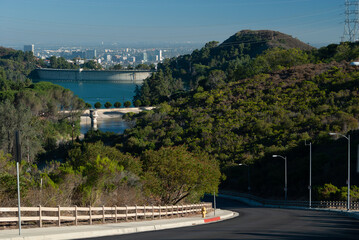 Lake Hollywood on a sunny day with a distance view of Los Angeles