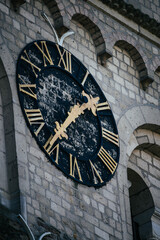 a clock on a tower on the side of a building