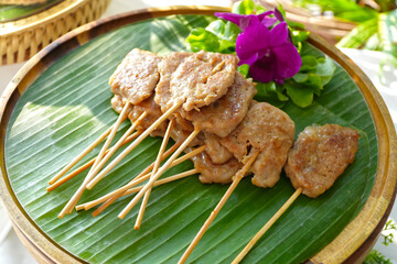 Grilled pork sticks serving in restaurant.