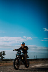 a man is riding his motorcycle in the middle of the road