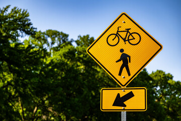 Road sign of a bicycle trail on a sunny day