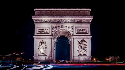 Nighttime shot of the Arc de Triomphe in Paris, France
