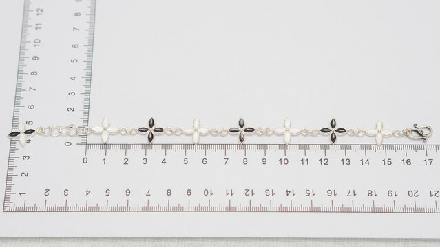 Handmade silver jewelry display on white background