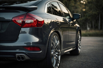 Fototapeta premium An image of a car from back view, emphasizing tail light