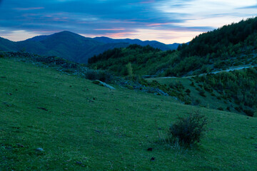 sunset in green mountain hills