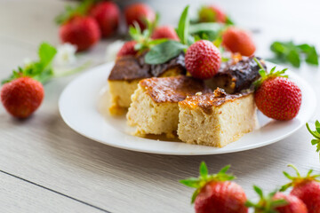 prepared cottage cheese casserole with fresh strawberries