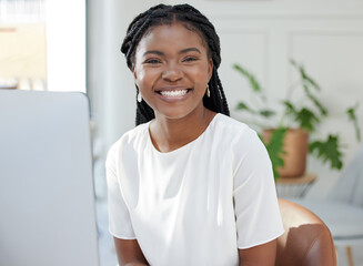 African woman, portrait and computer at startup with smile, pride and career in copywriting on web....