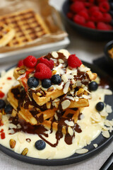 Dutch waffles with vanilla sauce, chocolate and berries.