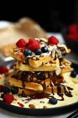 Dutch waffles with vanilla sauce, chocolate and berries.