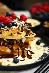 Dutch waffles with vanilla sauce, chocolate and berries.
