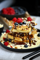 Dutch waffles with vanilla sauce, chocolate and berries.