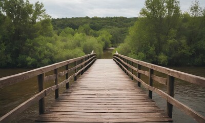 Obraz premium Landscape of an old wooden bridge crosses over a river in nature daylight
