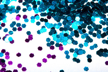 Close Up of Color Shiny Confetti Glitter On White Background