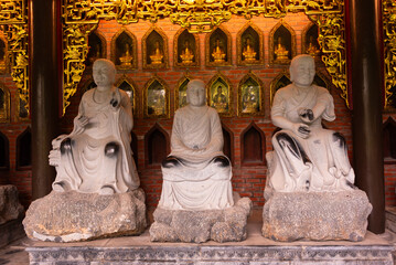 Many Buddha statues in a hindu pagoda in Vietnam