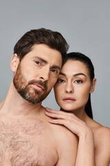 Fototapeta premium A man and a woman, showcasing their magnetic beauty while posing for a picture.