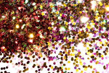 Close Up of Color Shiny Confetti Glitter On White Background
