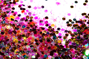 Close Up of Color Shiny Confetti Glitter On White Background