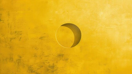 A study in contrast - a floating circle on a bold yellow solid colored texture canvas.