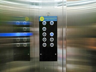 Elevator buttons panel with contactless button