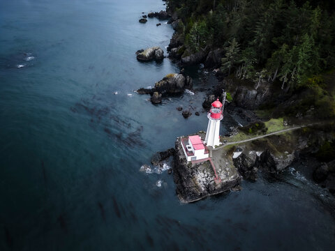Aerial view of beautiful coastline with lighthouse, Sooke, British Columbia, Canada.