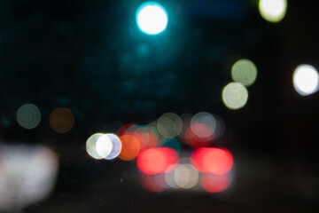 Colorful bokeh lights - scattered circles - reds, greens, whites, yellows - dark, moody background....