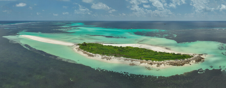 Aerial view of idyllic coral island in the Laccadive Sea, Outer Islands, Seychelles.
