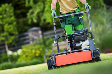 Landscaper Operating Gasoline Powered Aerator
