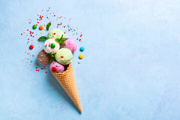 Ice cream cone with various scoops and sprinkles