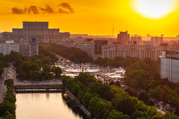 Bucharest from above during sunset. Aerial view over Unirii Square, Boulevard and Palace of the...
