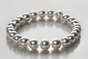 Obraz premium A luxurious pearl choker with perfectly round pearls strung closely together, representing timeless elegance