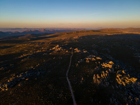 Aerial view of Karoo landscape with mountain peaks at sunset, Drie Kuilen, Western Cape, South Africa.