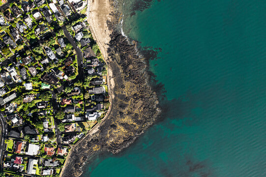 Aerial view of beautiful coastal shoreline with blue ocean waves, Takapuna, Auckland, New Zealand, Milford, Castor bay.