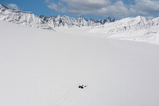 Aerial view of snow-covered Sim Gang glacier, camp site, Gilgit-Baltistan, Pakistan.