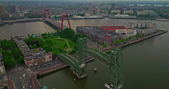 Aerial view Rotterdam, Netherlands. Willemsbrug Bridge. Noordereiland Island. View of the city center. River Nieuwe Maas. Sunset