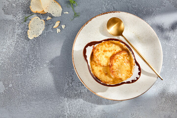 Onion soup with bubbly melted cheese, rich and comforting dish presented on a textured background