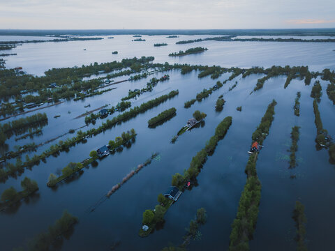 Aerial view of flooded wetland with floating houses and boats, Scheendijk, Breukelen, The Netherlands.