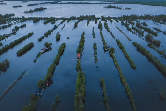 Aerial view of floating houses and boats on river, Scheendijk, The Netherlands.
