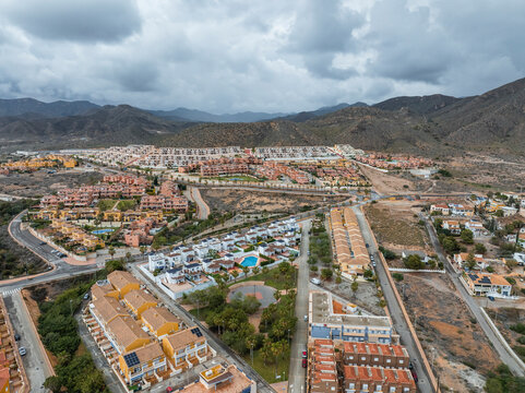 Aerial view of Isla Plana town with beautiful mountain landscape, Murcia, Spain.