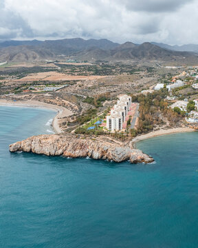 Aerial view of beautiful seaside coast at sunset, Isla Plana, Cartagena, Murcia, Spain.