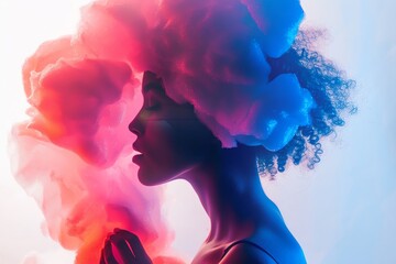 Silhouette of a person with colorful smoke effect. Creative, artistic, and visually striking with vibrant hues of pink and blue contrasted.