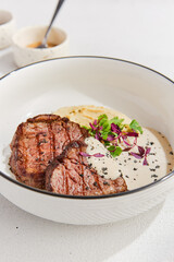 Beef Medallions with Creamy Sauce and Mashed Potatoes - Elegant Plated Meal