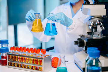 Modern medical research laboratory. female scientist hands working with micro pipettes analyzing...