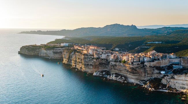 Aerial drone view of Bonifacio during sunset, Mediterranean coastal town in summer, island of Corsica, France.